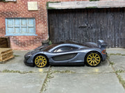 Hot Wheels McLaren P1 Supernova Silver loose car with gold-tone wheels, left-side view