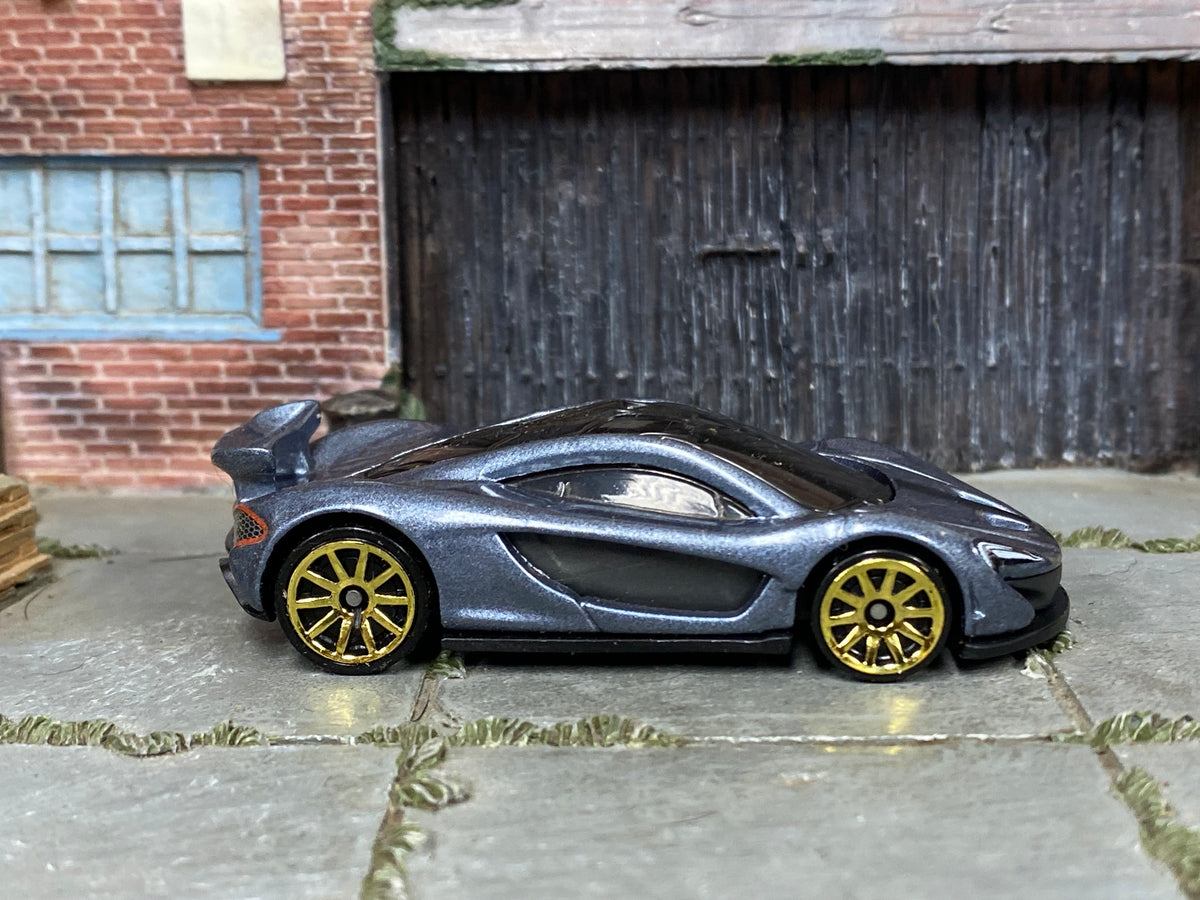 Hot Wheels McLaren P1 Supernova Silver loose car with gold-tone wheels, right-side view