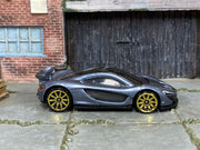 Hot Wheels McLaren P1 Supernova Silver loose car with gold-tone wheels, right-side view