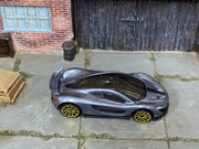 Hot Wheels McLaren P1 Supernova Silver loose car with gold-tone wheels, top view