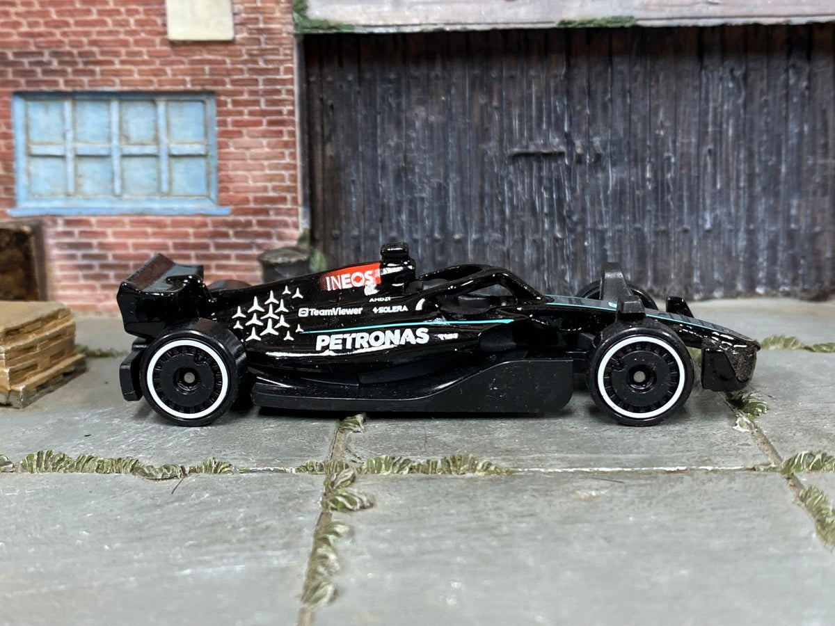 Hot Wheels Mercedes-AMG Petronas Formula One Team black and turquoise loose car, right-side view