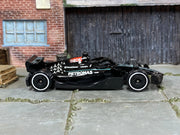 Hot Wheels Mercedes-AMG Petronas Formula One Team black and turquoise loose car, right-side view