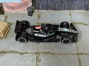 Hot Wheels Mercedes-AMG Petronas Formula One Team black and turquoise loose car, top view