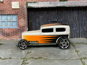 Hot Wheels Midnight Otto pearl white with orange and black graphics, left side view