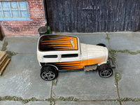 Hot Wheels Midnight Otto pearl white with orange and black graphics, top view