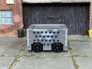Gray Hot Wheels Minecraft Minecart with pixel blocks, side view