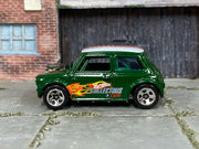 Dark green Hot Wheels Mini Cooper with Collectors graphics, loose car left side view