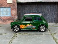 Dark green Hot Wheels Mini Cooper with Collectors graphics, loose car left side view