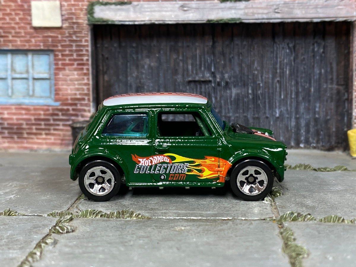 Dark green Hot Wheels Mini Cooper with Collectors graphics, loose car right side view