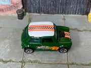 Dark green Hot Wheels Mini Cooper with Collectors graphics, loose car top view