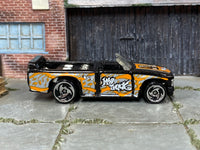Hot Wheels Mini Truck black and orange Street Art, right side view with visible play wear