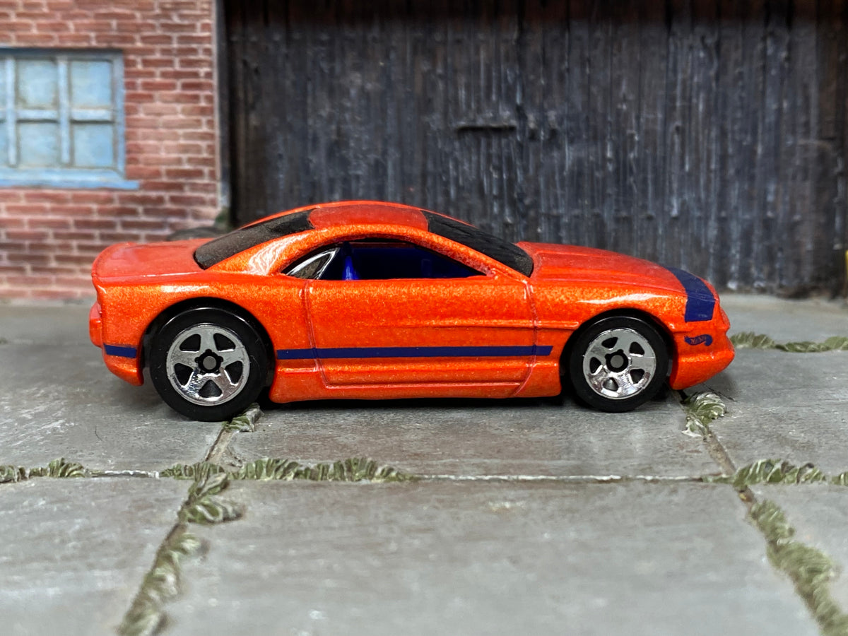 Hot Wheels Muscle Tone orange with purple stripes, right side view