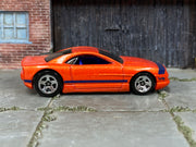Hot Wheels Muscle Tone orange with purple stripes, right side view