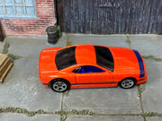 Hot Wheels Muscle Tone orange with purple stripes, top view
