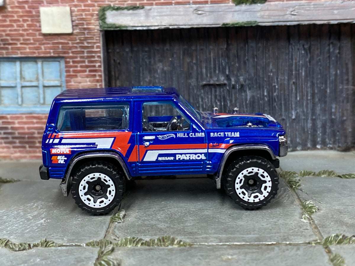 Hot Wheels Nissan Patrol Custom blue Hill Climb Race Team, right side view