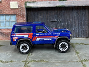 Hot Wheels Nissan Patrol Custom blue Hill Climb Race Team, right side view