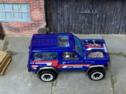 Hot Wheels Nissan Patrol Custom blue Hill Climb Race Team, top view