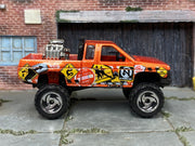 Hot Wheels Nissan Truck Mixed Signals orange, right-side view