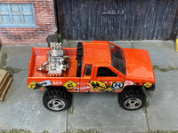 Hot Wheels Nissan Truck Mixed Signals orange, top view