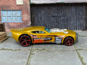 Hot Wheels Nitro Doorslammer metallic gold with red wheels — right side view