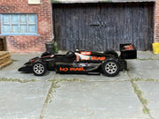 Hot Wheels No Fear Race Car in black with number 1, left side view