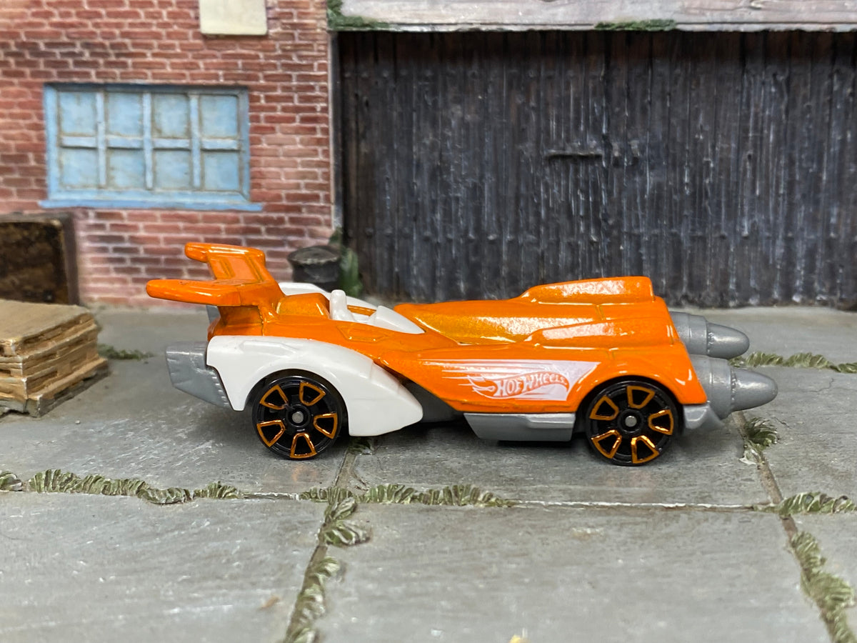 Hot Wheels Ollie Rocket orange 2026 X6999 loose vehicle, side view