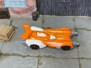 Hot Wheels Ollie Rocket orange 2026 X6999 loose vehicle, top view