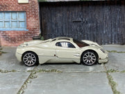 Hot Wheels Pagani Utopia in pearl light gray, right-side view of loose car