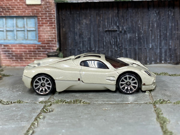 Hot Wheels Pagani Utopia in pearl light gray, right-side view of loose car