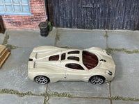 Hot Wheels Pagani Utopia in pearl light gray, top view of loose car