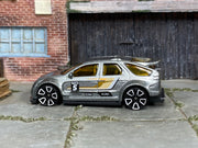 Hot Wheels Pontiac Aztek Custom in silver with number 5, left side view