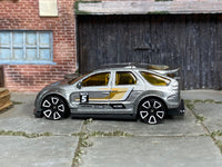 Hot Wheels Pontiac Aztek Custom in silver with number 5, left side view