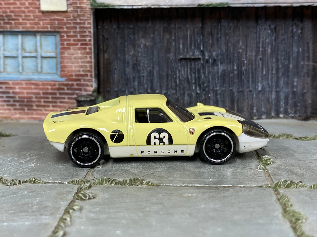 Hot Wheels Porsche 904 Carrera GTS pale yellow number 63 loose car, right-side view