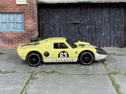 Hot Wheels Porsche 904 Carrera GTS pale yellow number 63 loose car, right-side view