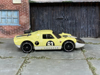 Hot Wheels Porsche 904 Carrera GTS pale yellow number 63 loose car, right-side view
