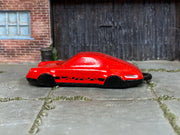 Hot Wheels Porsche 911 Carrera Clip red and black loose model, left-side view