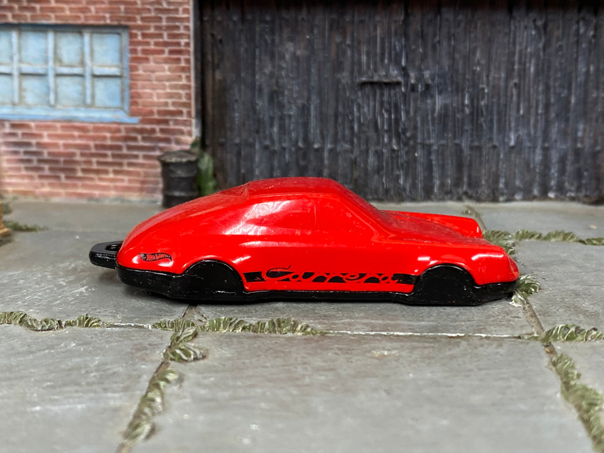 Hot Wheels Porsche 911 Carrera Clip red and black loose model, right-side view