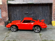 Hot Wheels Porsche P-911 red with silver three-spoke wheels, left side view