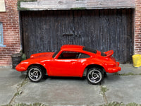 Hot Wheels Porsche P-911 red with silver three-spoke wheels, left side view