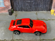 Hot Wheels Porsche P-911 red with silver three-spoke wheels, top view
