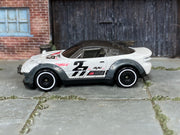Hot Wheels Rally Cat 2026 Nightburnerz JKG21 loose car, left-side view