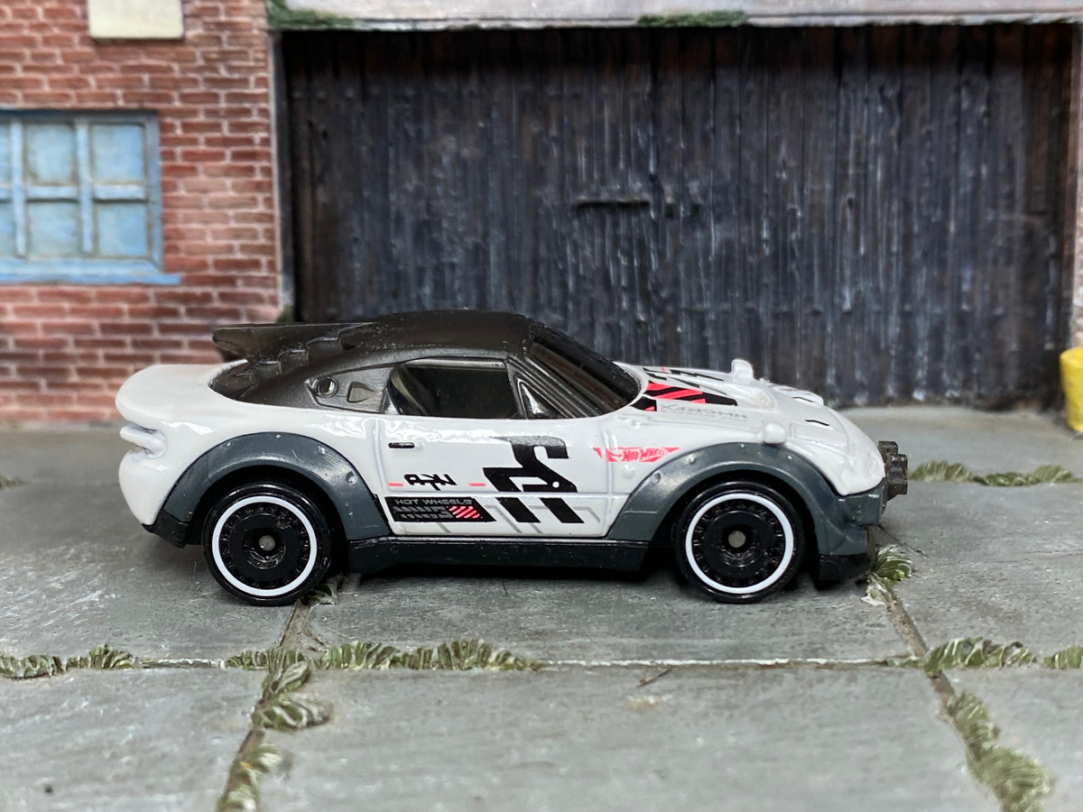 Hot Wheels Rally Cat 2026 Nightburnerz JKG21 loose car, right-side view
