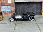 Hot Wheels Ratical Racer dark gray with silver flames, left-side view