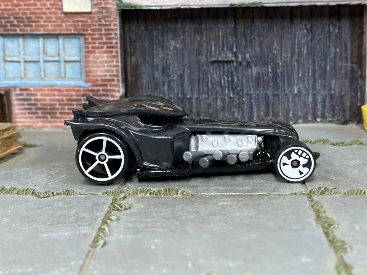 Hot Wheels Ratical Racer dark gray with silver flames, right-side view