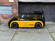 Hot Wheels Renault Espace F1 black upper body and yellow lower body, left-side view