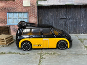 Hot Wheels Renault Espace F1 black upper body and yellow lower body, right-side view