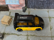 Hot Wheels Renault Espace F1 black upper body and yellow lower body, top view