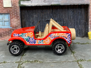 Hot Wheels Roll Patrol red Hawaii floral graphics, left side view