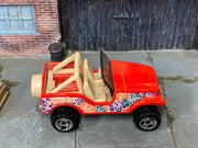 Hot Wheels Roll Patrol red Hawaii floral graphics, top view