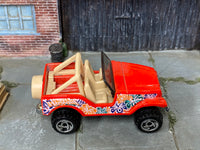 Hot Wheels Roll Patrol red Hawaii floral graphics, top view